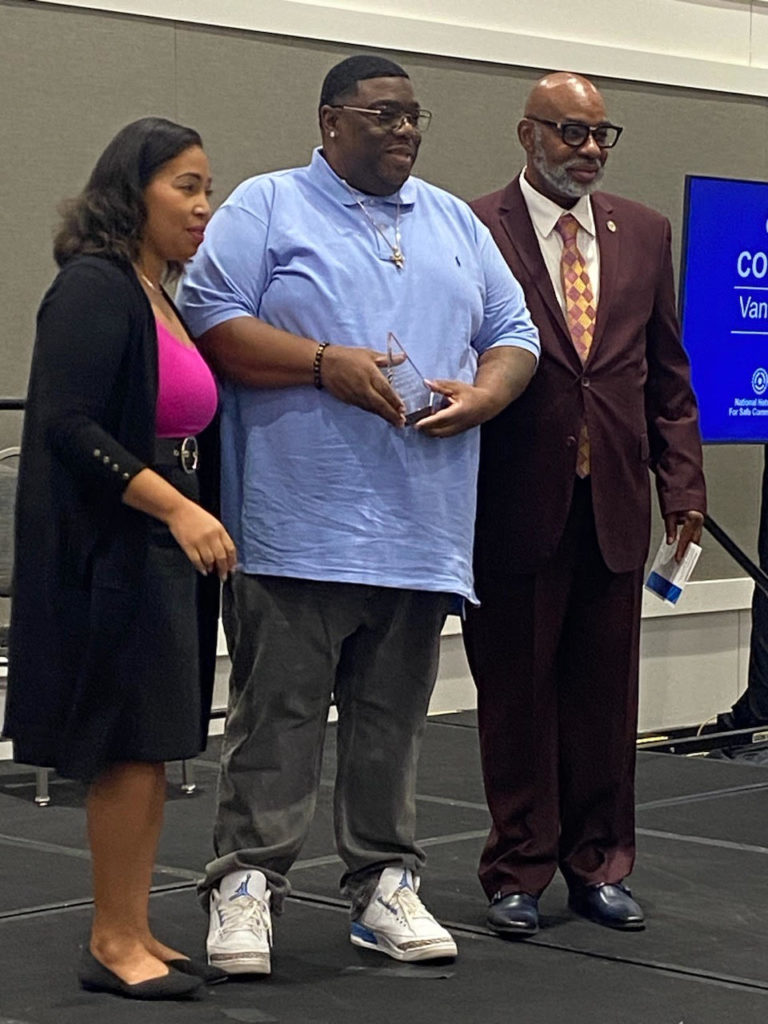 Ferome Brown receiving a Community Vanguard Award from National Network for Safe Communities representatives